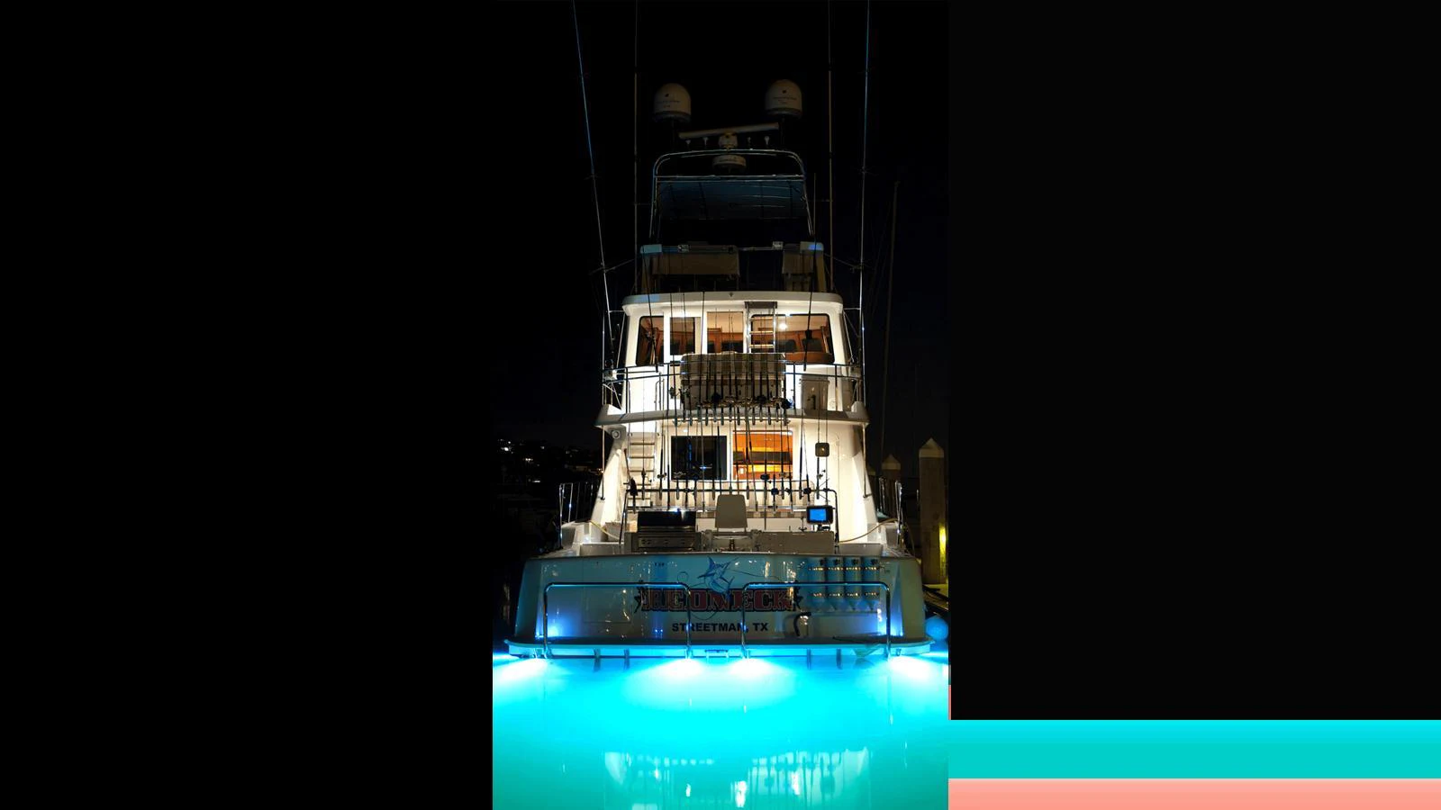 A stunning yacht illuminated at night, showcasing its elegant design and inviting ambiance. aboard MIKELSON 75 SPORTFISHER Yacht for Sale