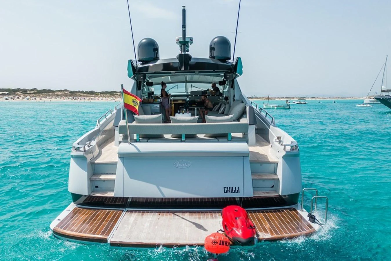 The yacht's aft deck offers a luxurious lounging area with easy access to the water. aboard BAIA 70 Yacht for Sale