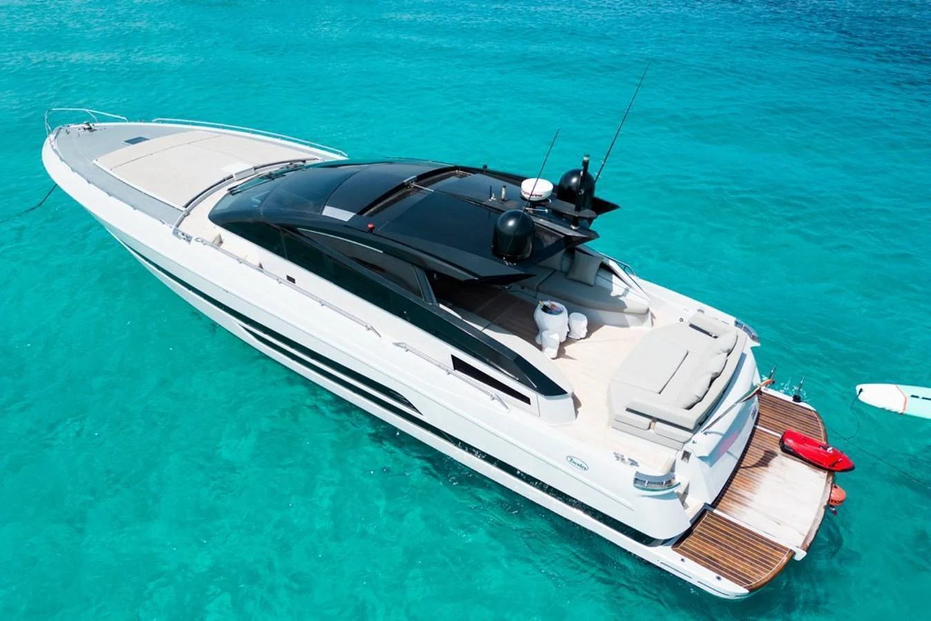 A sleek and modern yacht cruising on clear turquoise waters. aboard BAIA 70 Yacht for Sale