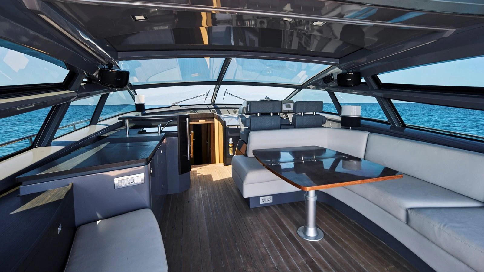 The yacht's saloon features a spacious seating area with panoramic views. aboard BAIA 70 Yacht for Sale