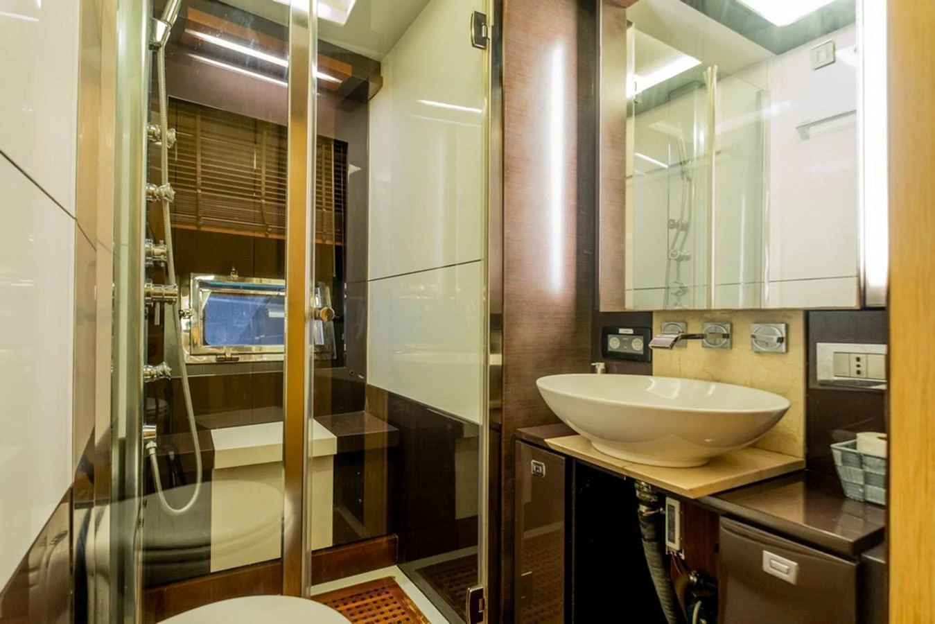 The yacht's bathroom features modern fixtures and a sleek design. aboard BAIA 70 Yacht for Sale