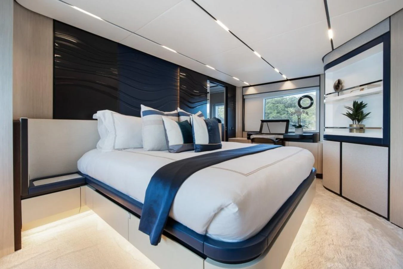 The master stateroom features a luxurious bed with elegant decor and ample natural light. aboard TOPAZ Yacht for Sale