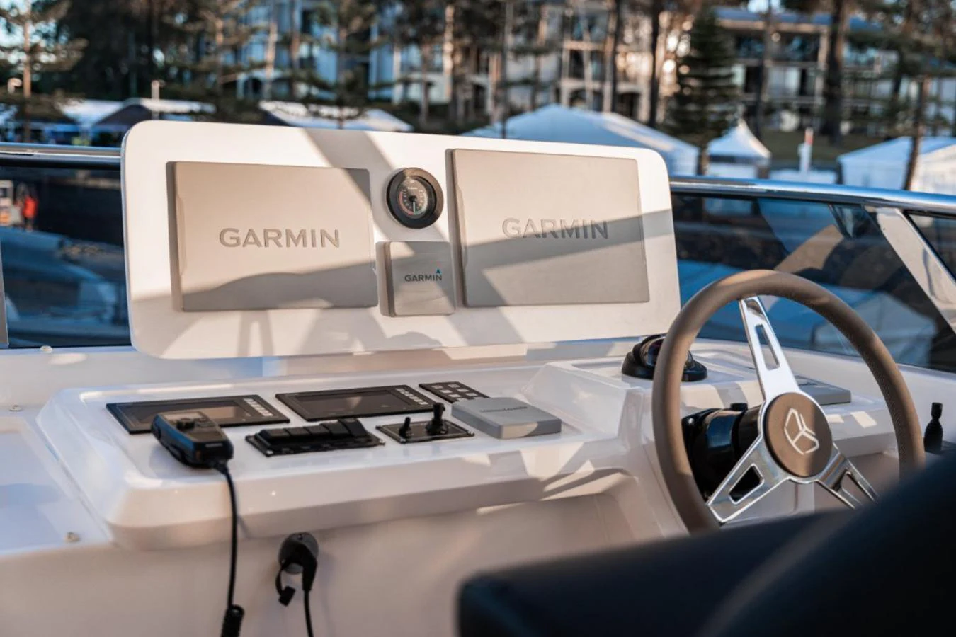 The helm station features advanced navigation equipment and a sleek steering wheel. aboard TOPAZ Yacht for Sale