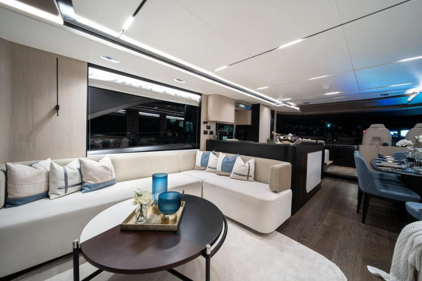 The yacht's salon features a modern and elegant design with comfortable seating and ambient lighting. aboard TOPAZ Yacht for Sale