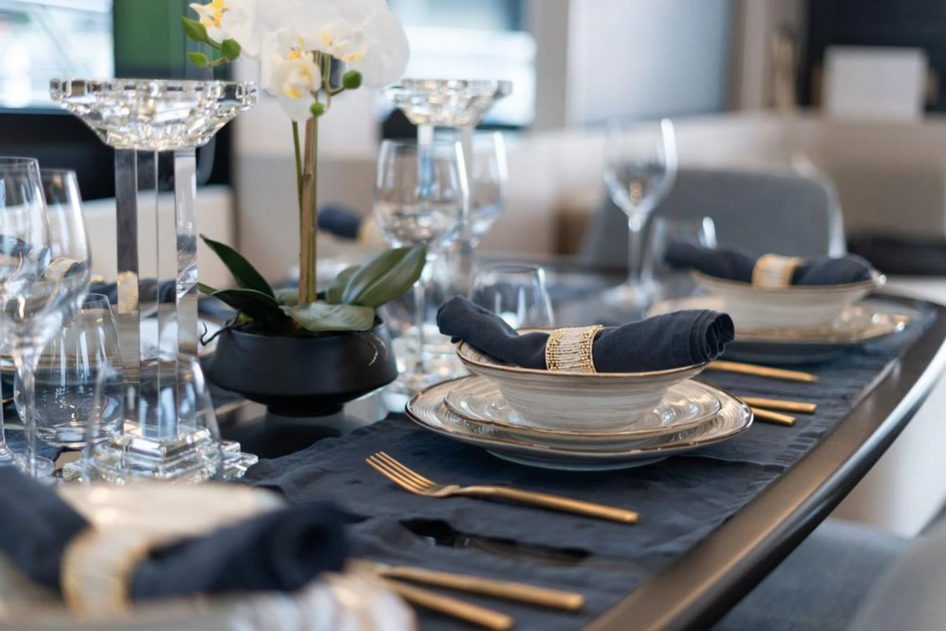 A sophisticated dining area set with elegant tableware and luxurious decor. aboard TOPAZ Yacht for Sale
