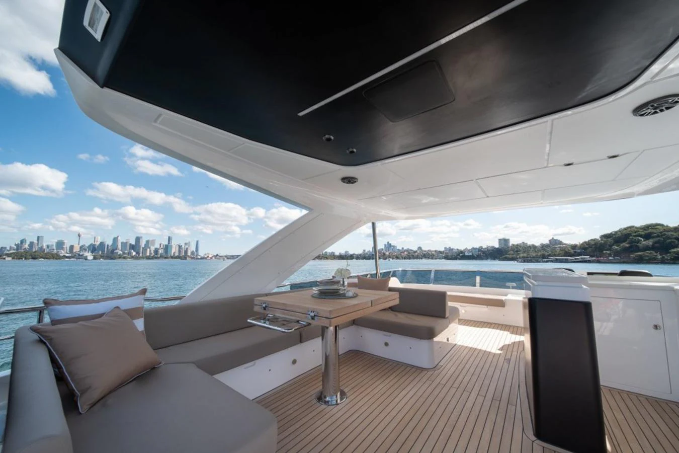 The aft deck offers a spacious and comfortable area for relaxation and dining with stunning views of the water and city skyline. aboard TOPAZ Yacht for Sale