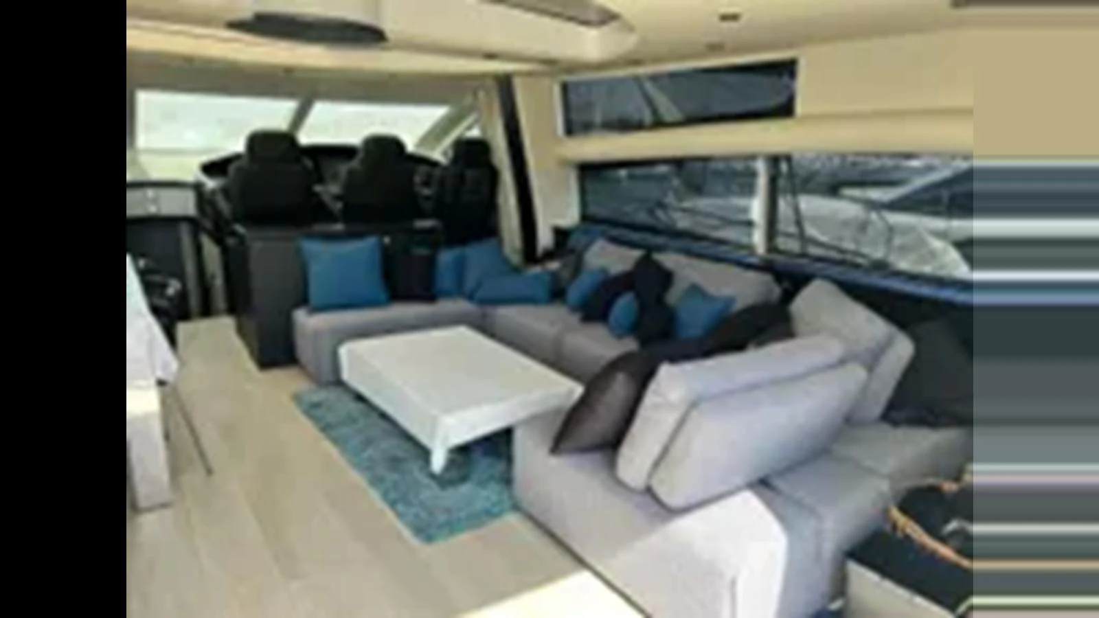 The salon features a spacious seating area with plush sofas and a modern coffee table, complemented by large windows for natural light. aboard 2006 SUNSEEKER PREDATOR 82 Yacht for Sale