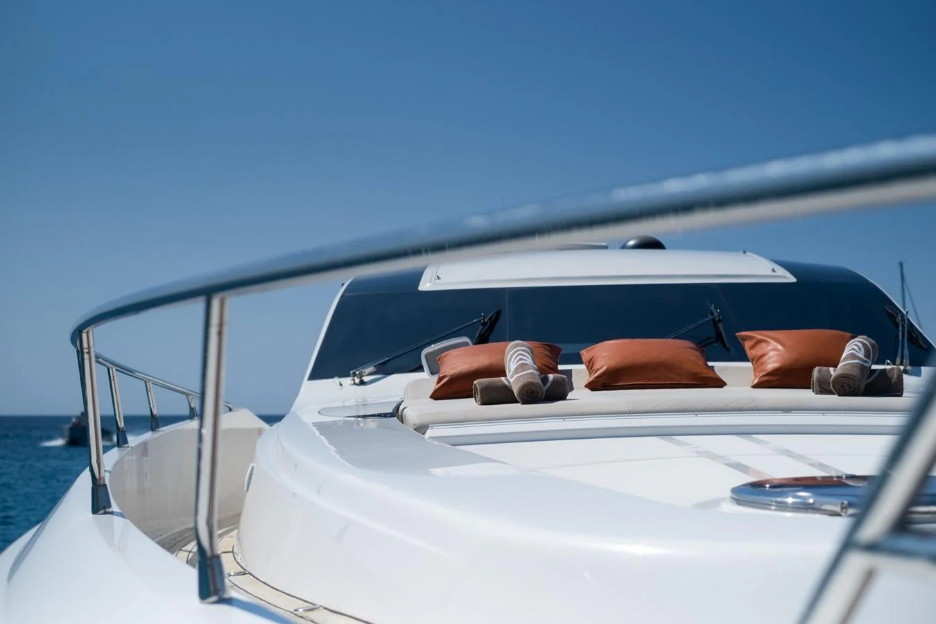 a man and woman sitting on a boat aboard CANADOS 90 #4 Yacht for Sale