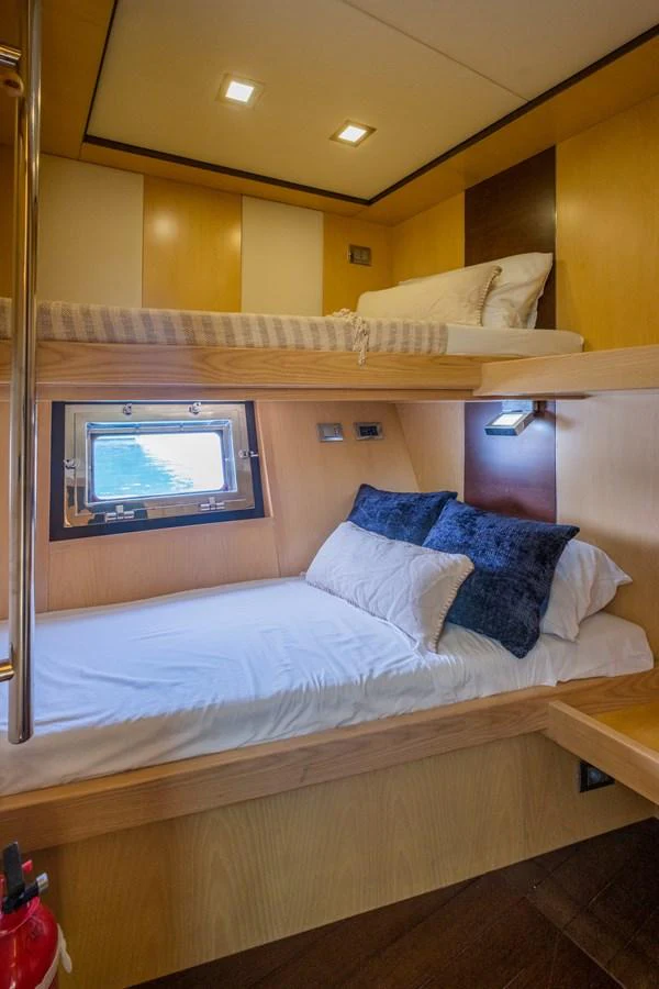 a bed with a white bed aboard CANADOS 90 #4 Yacht for Sale