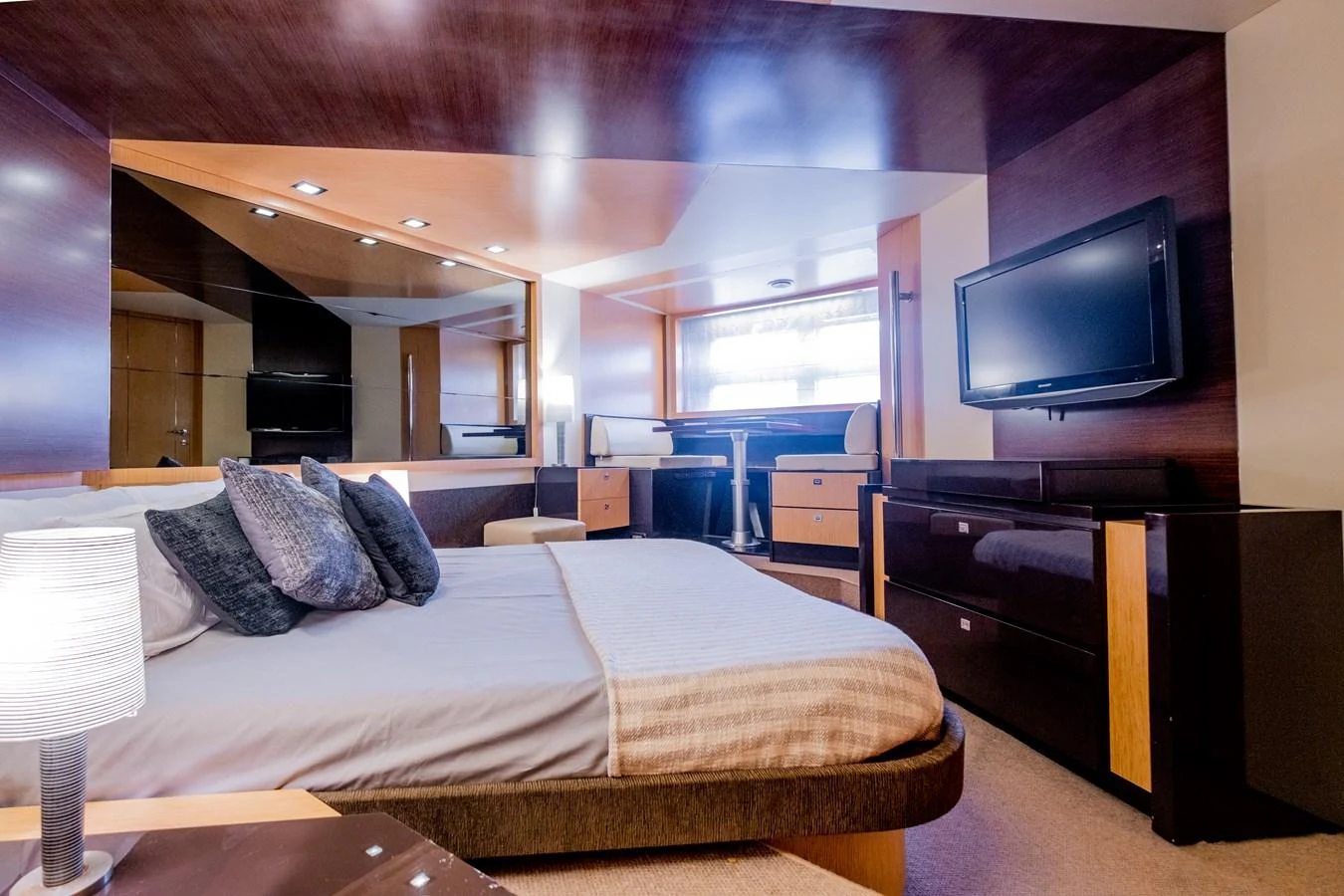 a hotel room with a bed and tv aboard CANADOS 90 #4 Yacht for Sale