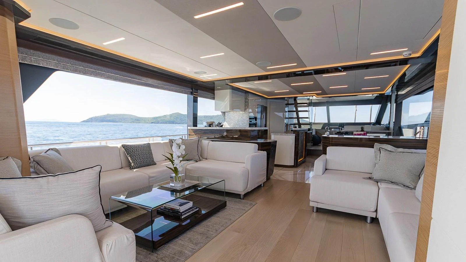 The salon offers a spacious and elegant living area with panoramic views and luxurious furnishings. aboard MAKORO Yacht for Sale