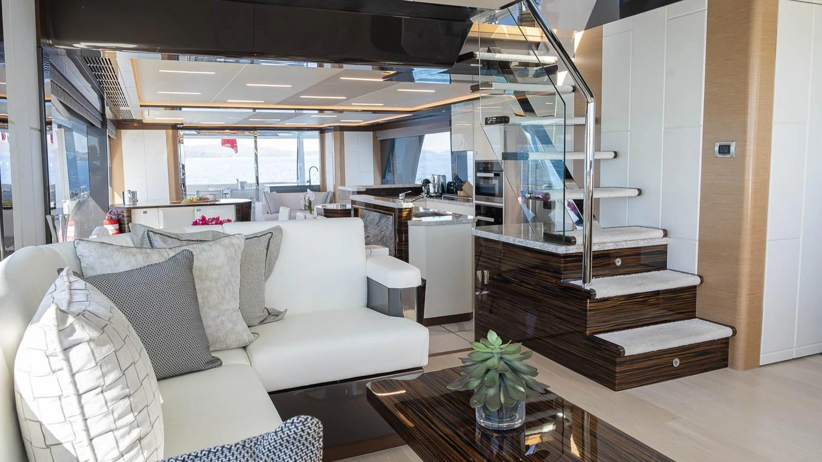 The yacht's salon features a modern and spacious design with comfortable seating and elegant decor. aboard MAKORO Yacht for Sale