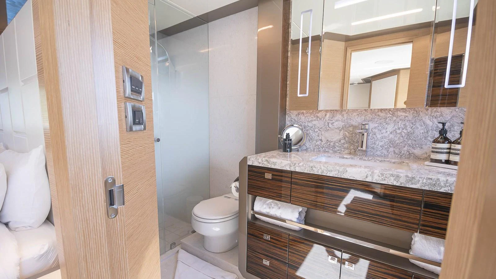 The yacht's bathroom features a sleek design with modern fixtures and luxurious finishes. aboard MAKORO Yacht for Sale