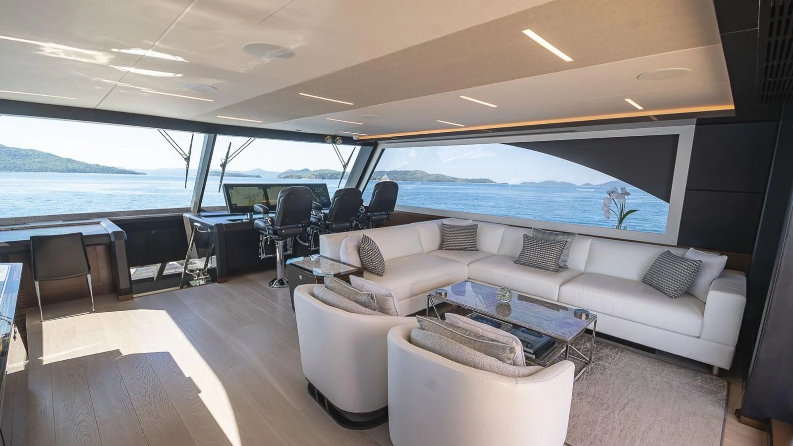 The salon features a spacious seating area with panoramic views of the sea. aboard MAKORO Yacht for Sale