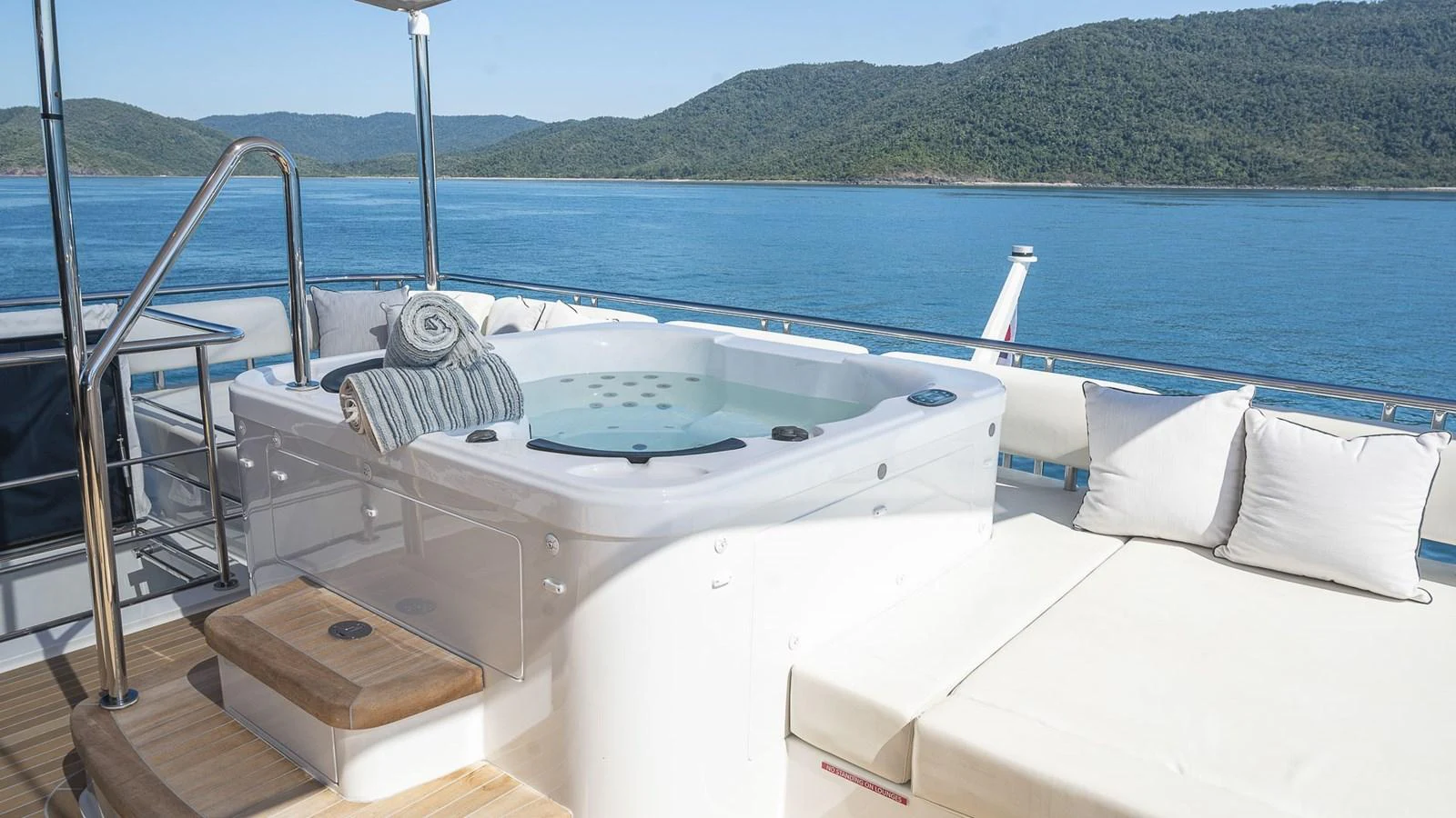 The yacht's sundeck features a luxurious hot tub with stunning views of the surrounding waters and landscape. aboard MAKORO Yacht for Sale