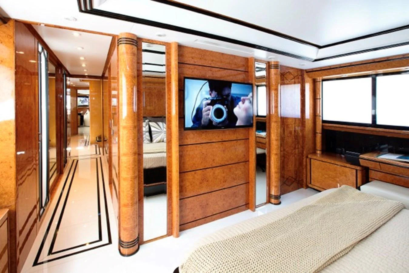 a room with a bed and a mirror aboard MILOS AT SEA Yacht for Sale