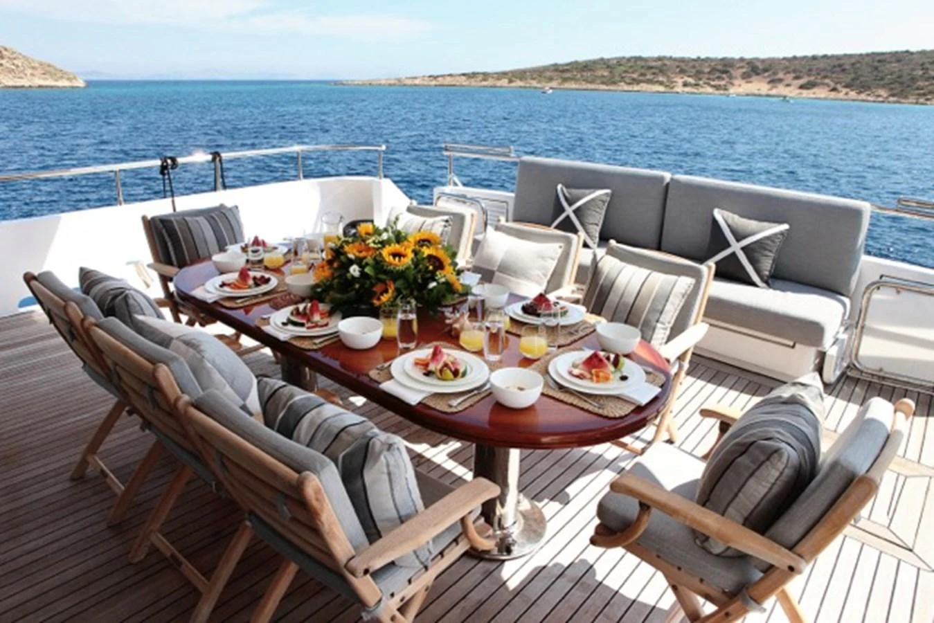 a table with food on it aboard MILOS AT SEA Yacht for Sale