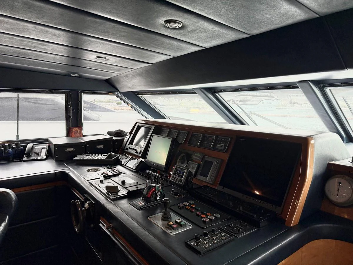 a room with many computers and monitors aboard MILOS AT SEA Yacht for Sale