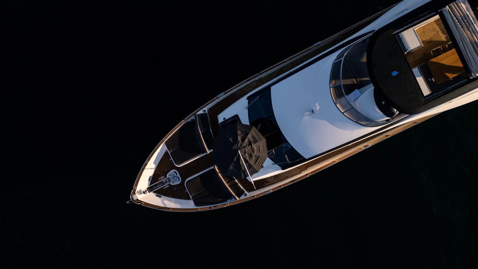 An aerial view of a sleek yacht showcasing its elegant design and spacious deck areas. aboard EBRA Yacht for Sale