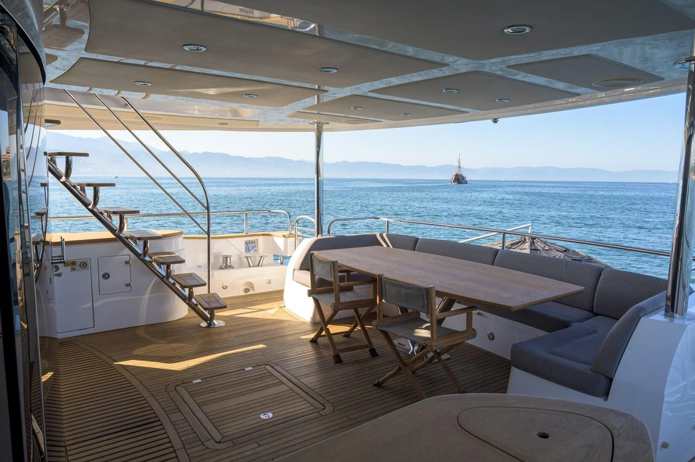 The aft deck offers a spacious and inviting area for dining and relaxation with stunning ocean views. aboard EBRA Yacht for Sale