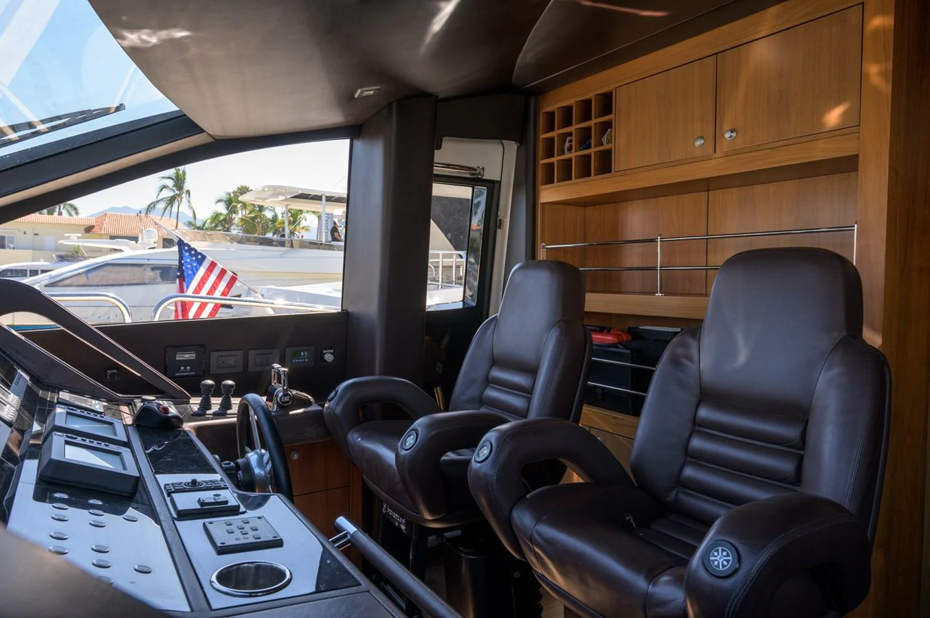 The helm features luxurious leather seats and state-of-the-art navigation equipment. aboard EBRA Yacht for Sale