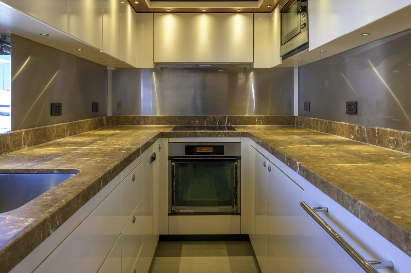 The yacht's galley features modern appliances and luxurious finishes, providing a stylish and functional space for culinary activities. aboard EBRA Yacht for Sale