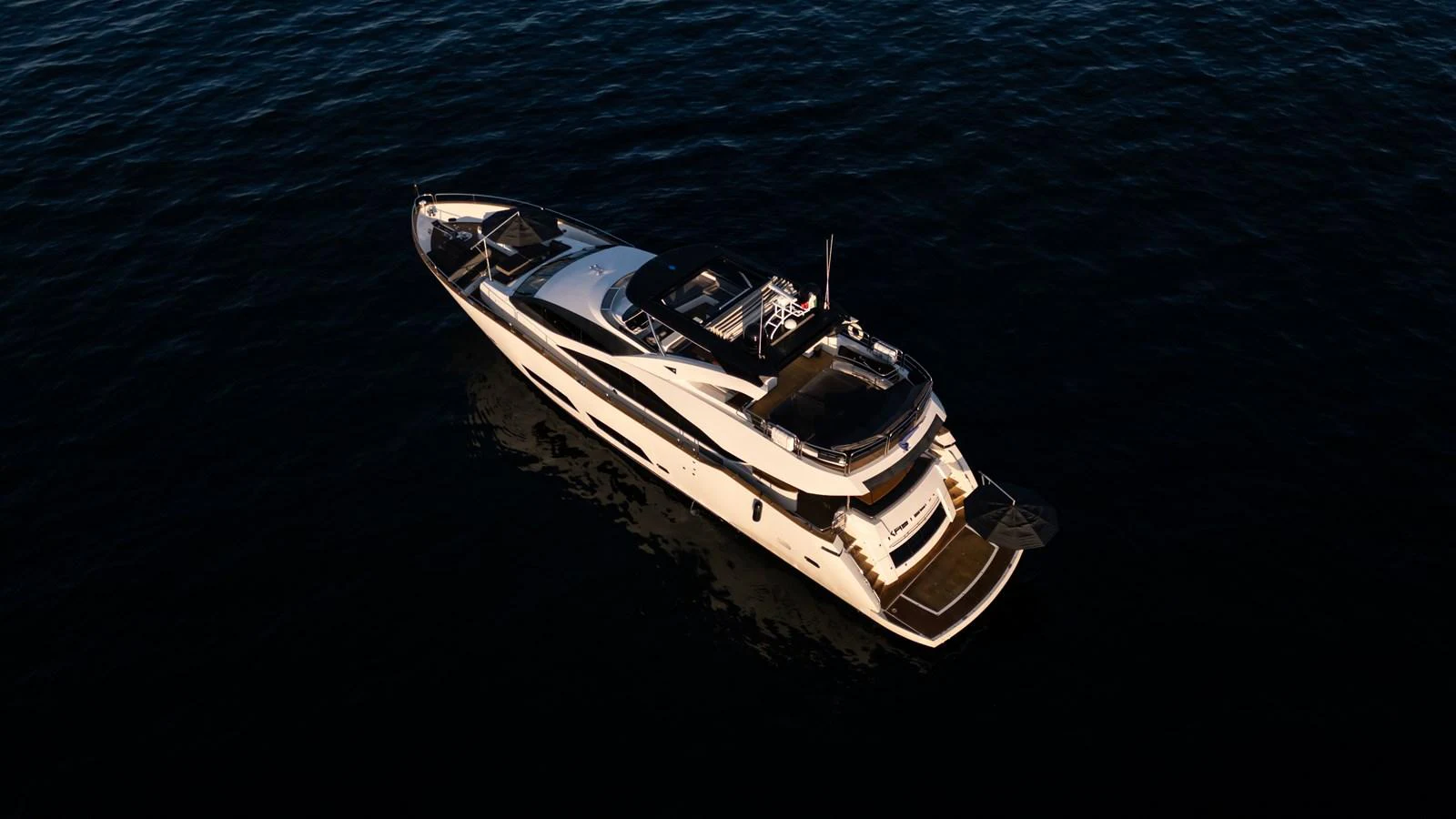 A sleek and modern yacht glides gracefully on the water, showcasing its elegant design. aboard EBRA Yacht for Sale