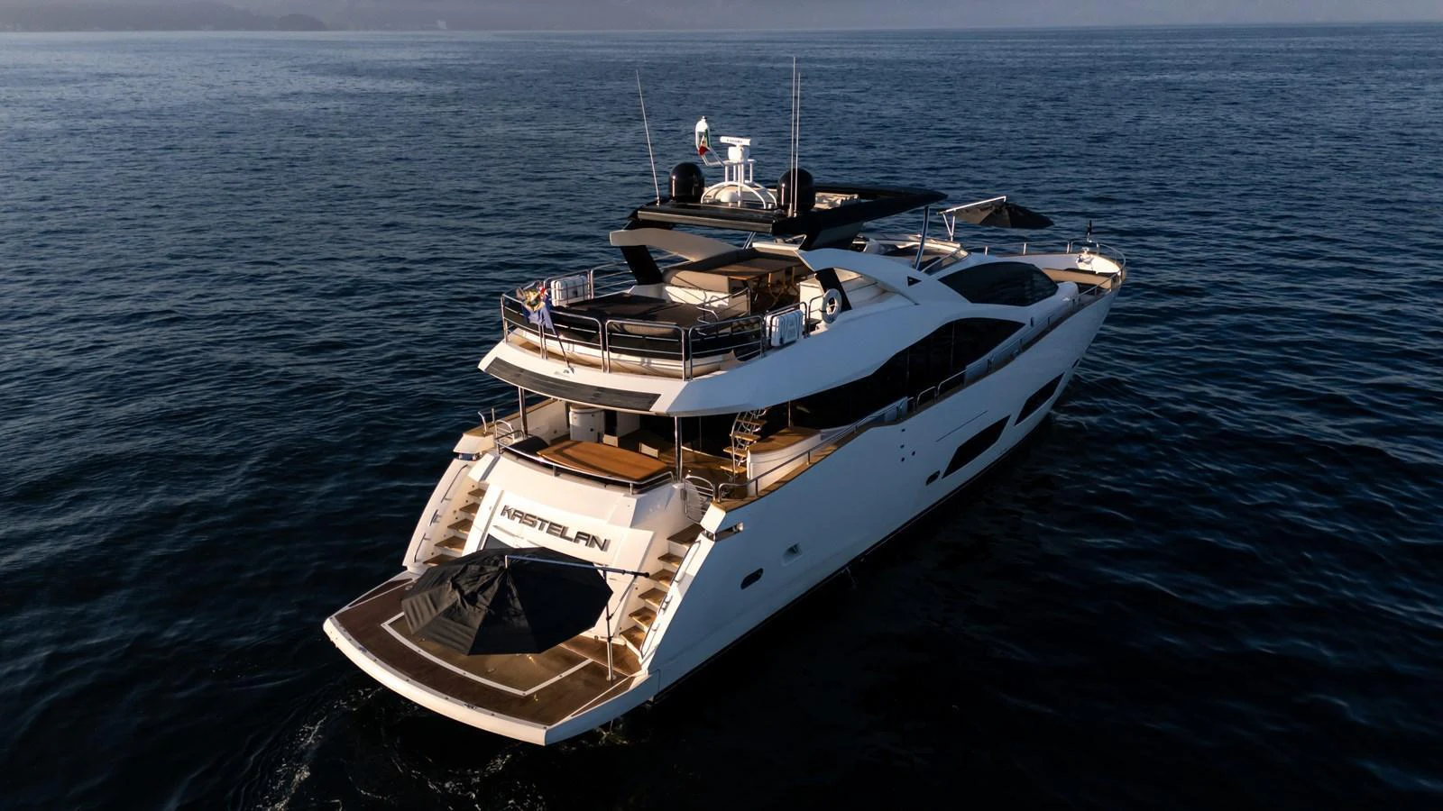A luxurious yacht glides gracefully on the open sea, showcasing its sleek design and spacious decks. aboard EBRA Yacht for Sale