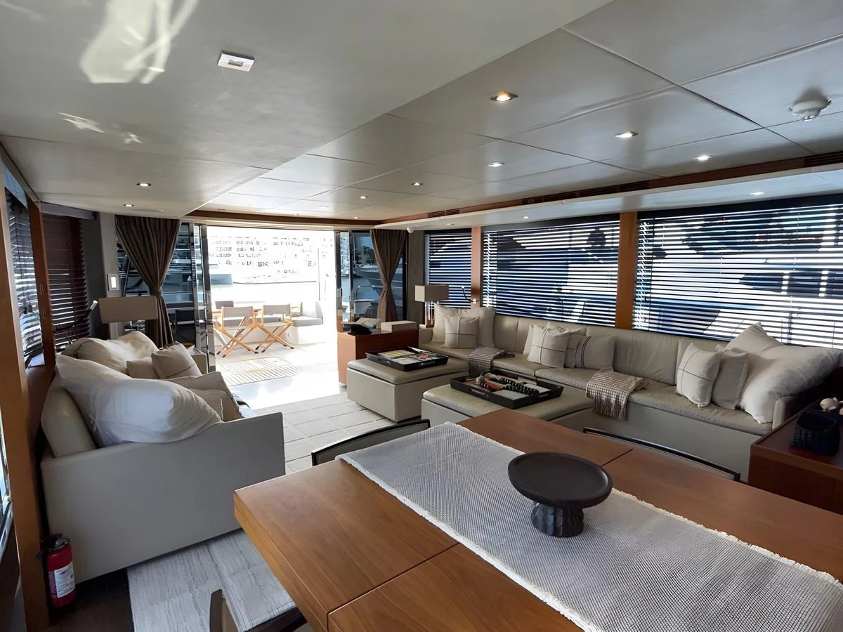The yacht's salon features a spacious and elegantly designed seating area with ample natural light. aboard EBRA Yacht for Sale