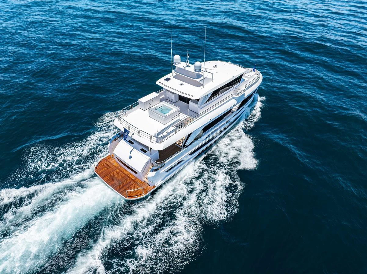 A luxurious yacht cruising through the open sea, showcasing its sleek design and spacious deck areas. aboard HORIZON FD80-617 / COMING FALL 2025 Yacht for Sale