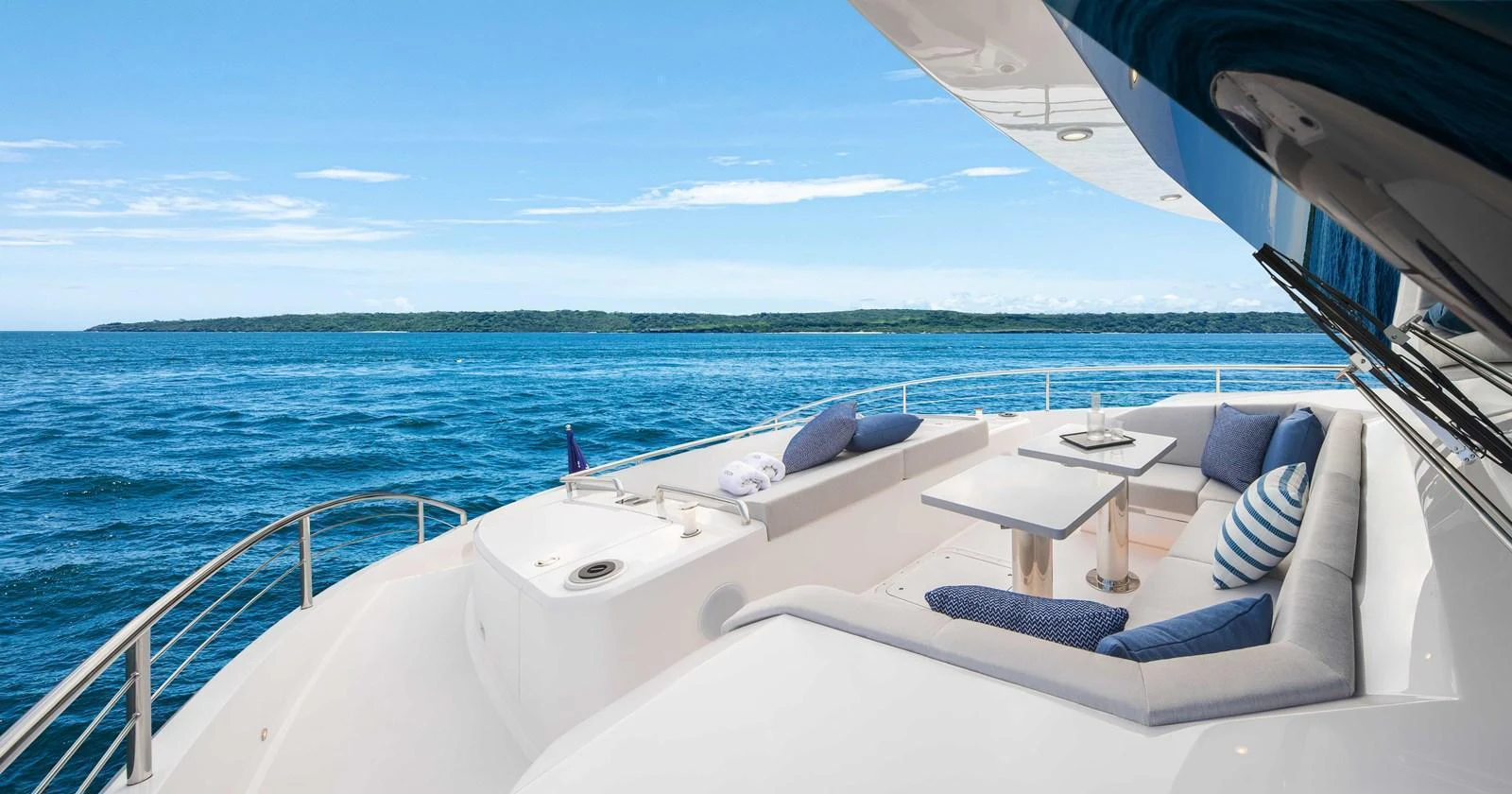 The aft deck offers a luxurious seating area with stunning ocean views. aboard HORIZON FD80-617 / COMING FALL 2025 Yacht for Sale