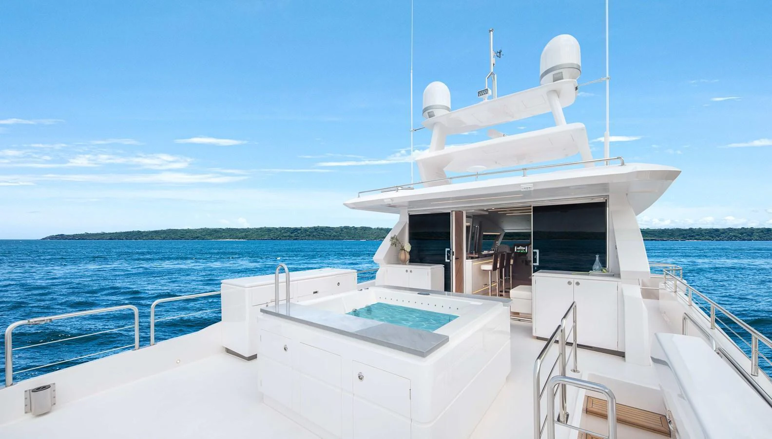 The sundeck features a luxurious jacuzzi with stunning ocean views. aboard HORIZON FD80-617 / COMING FALL 2025 Yacht for Sale