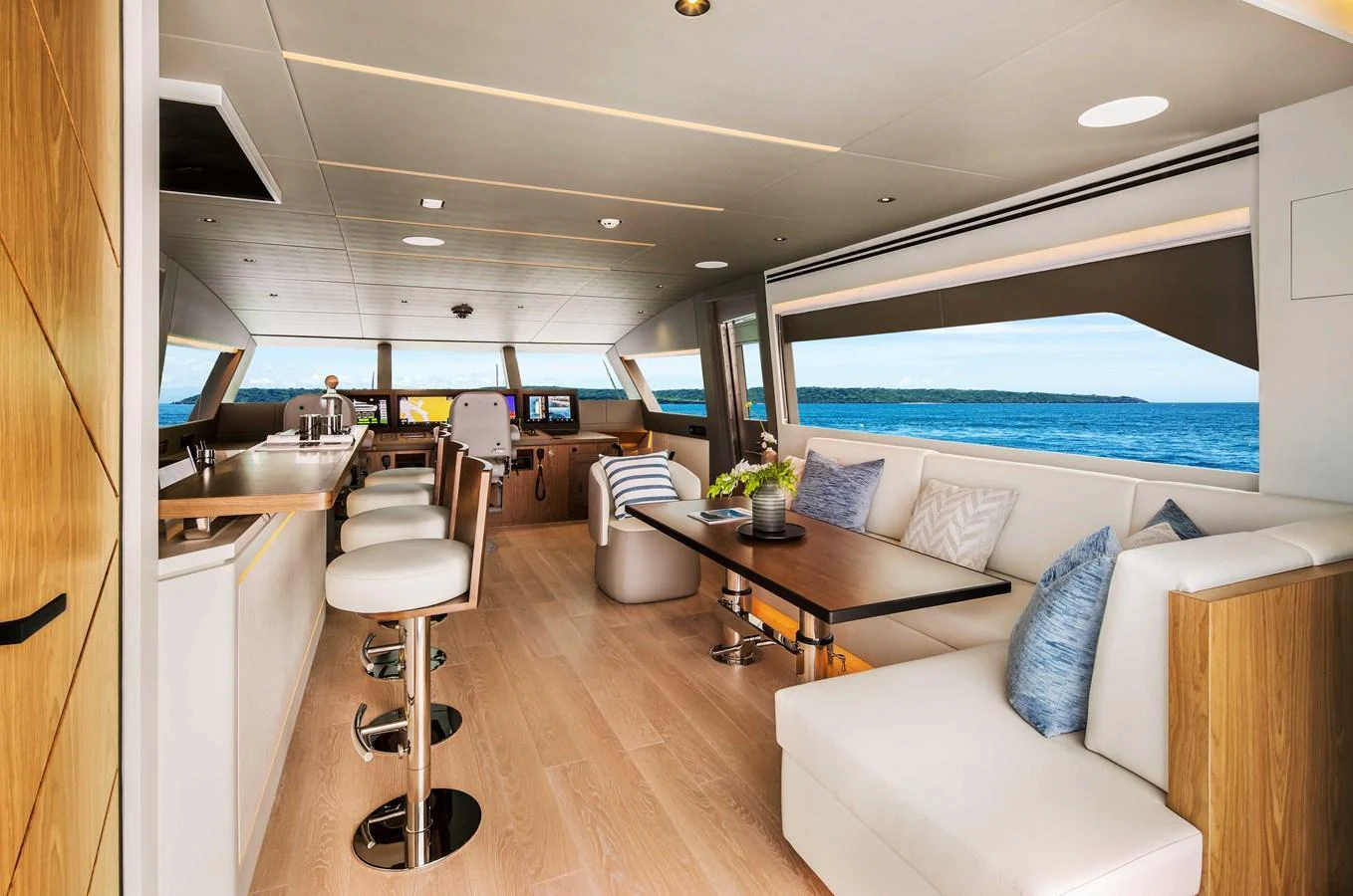 The yacht's salon features a spacious and modern design with ample seating and panoramic windows offering stunning sea views. aboard HORIZON FD80-617 / COMING FALL 2025 Yacht for Sale