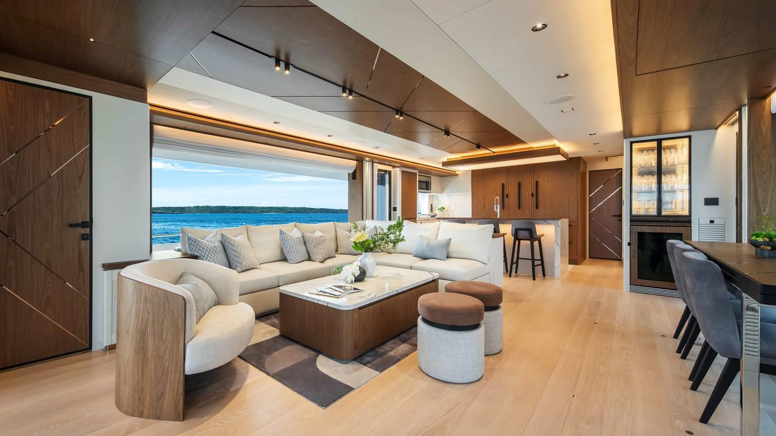 The spacious salon features elegant furnishings and a panoramic view of the sea. aboard HORIZON FD80-617 / COMING FALL 2025 Yacht for Sale