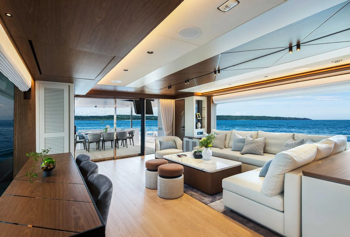 The salon offers a spacious and elegant living area with panoramic ocean views. aboard HORIZON FD80-617 / COMING FALL 2025 Yacht for Sale