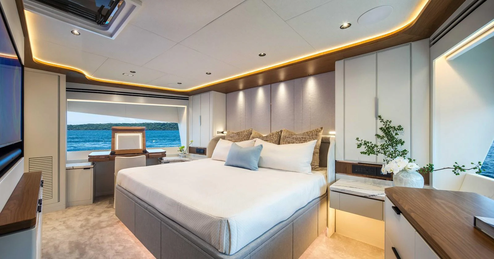 The master stateroom features a spacious bed, elegant decor, and large windows offering stunning sea views. aboard HORIZON FD80-617 / COMING FALL 2025 Yacht for Sale
