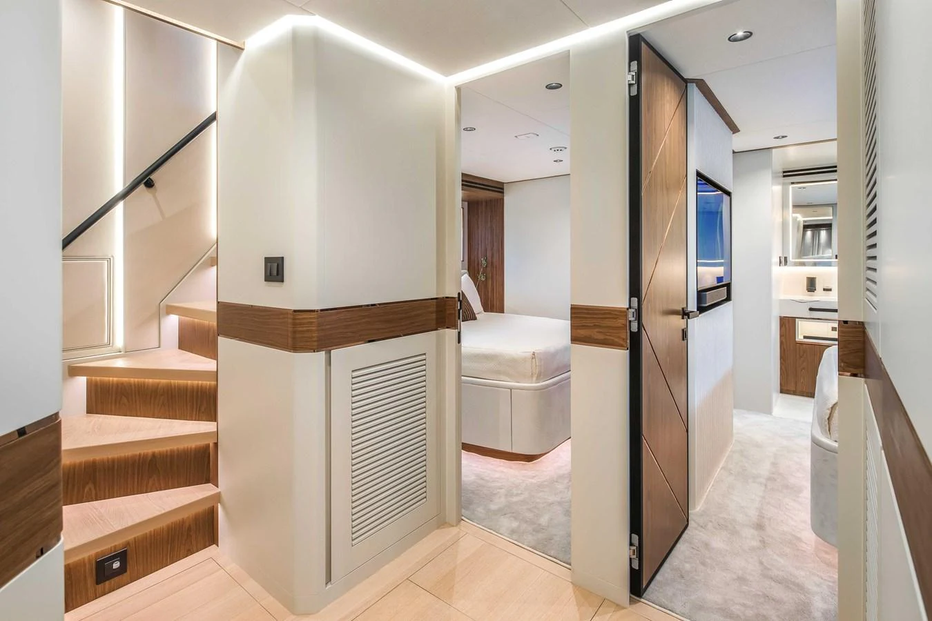 The yacht's interior features a modern hallway with access to a stateroom and a staircase. aboard HORIZON FD80-617 / COMING FALL 2025 Yacht for Sale