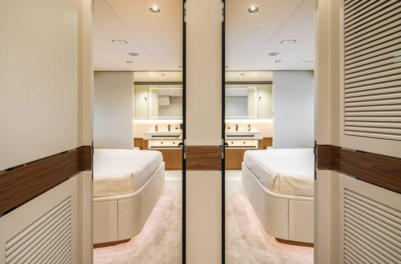 The image showcases a luxurious stateroom with a mirrored wall and elegant furnishings. aboard HORIZON FD80-617 / COMING FALL 2025 Yacht for Sale