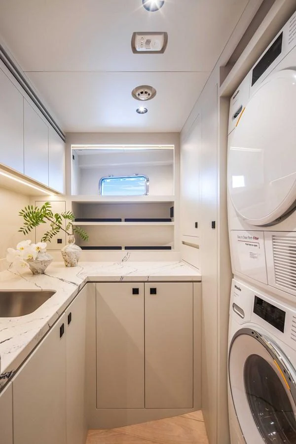 The yacht's laundry room is equipped with modern appliances and ample storage space, ensuring convenience and efficiency. aboard HORIZON FD80-617 / COMING FALL 2025 Yacht for Sale