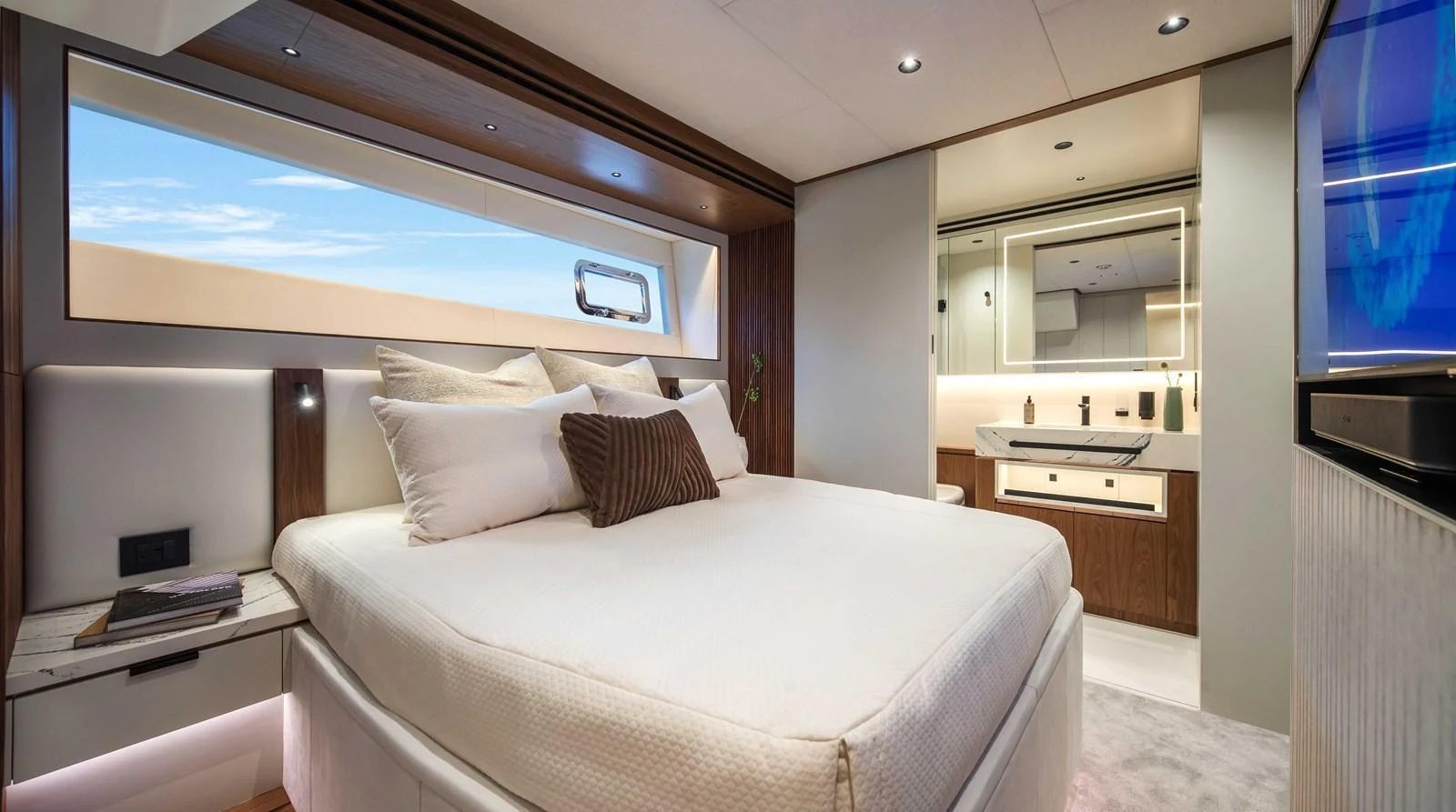 The master stateroom offers a luxurious and serene retreat with a large bed and modern ensuite bathroom. aboard HORIZON FD80-617 / COMING FALL 2025 Yacht for Sale
