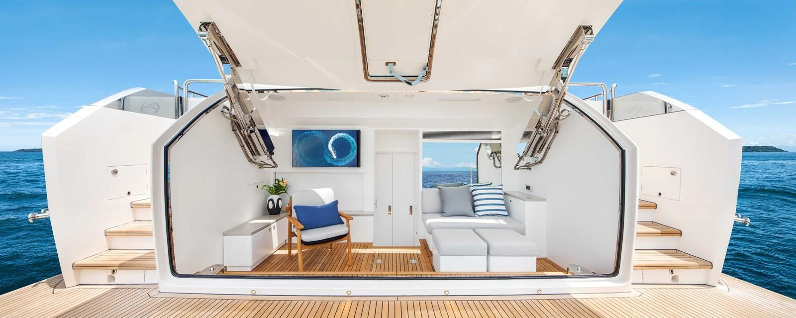 The beach club offers a luxurious space for relaxation right at the water's edge. aboard HORIZON FD80-617 / COMING FALL 2025 Yacht for Sale