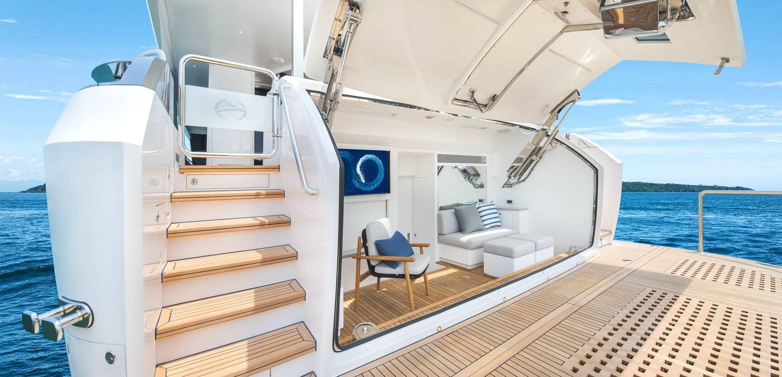 The yacht's aft deck features a luxurious seating area with a view of the open sea. aboard HORIZON FD80-617 / COMING FALL 2025 Yacht for Sale