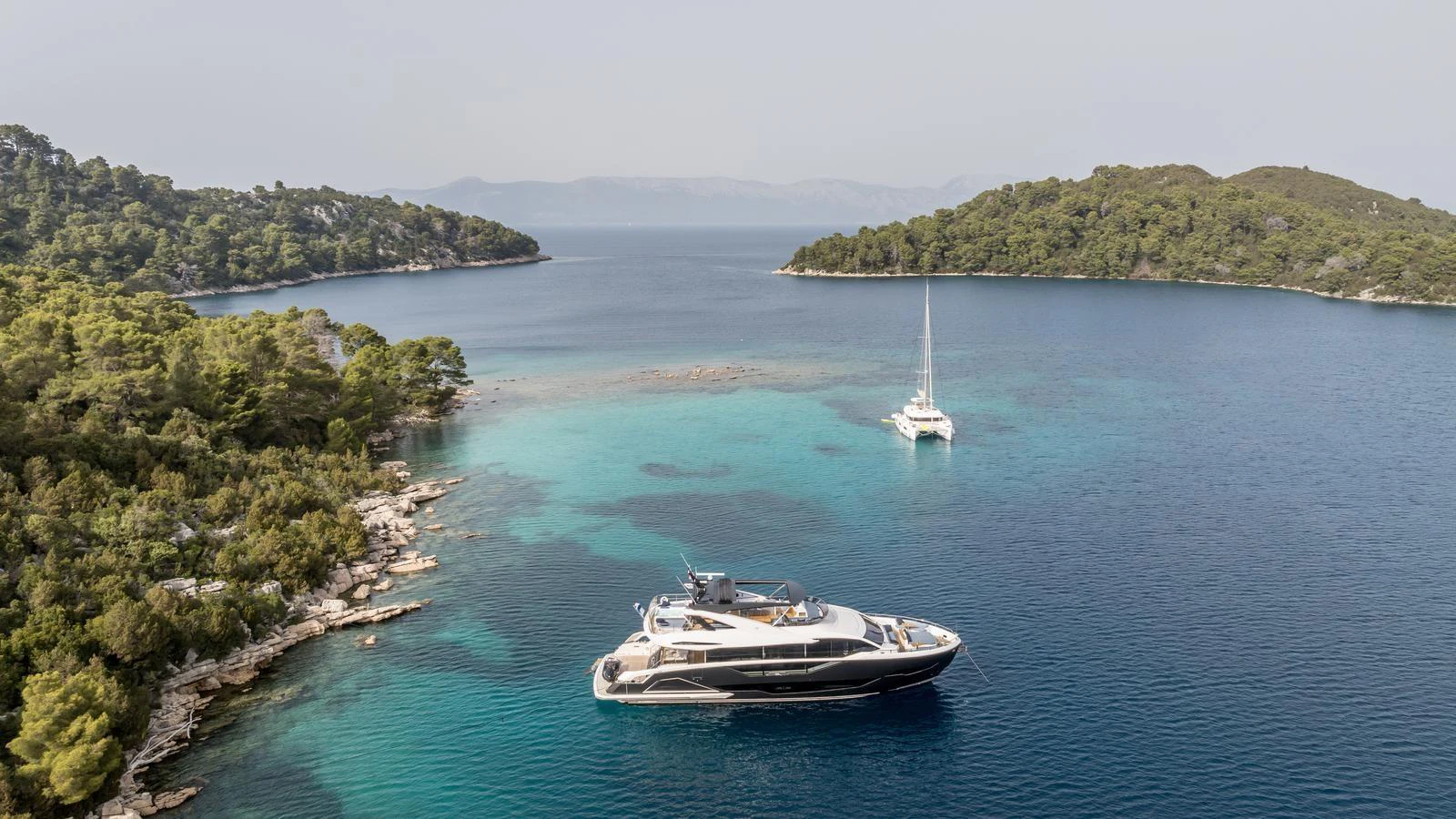 a boat sailing in the water aboard EXIT Yacht for Sale