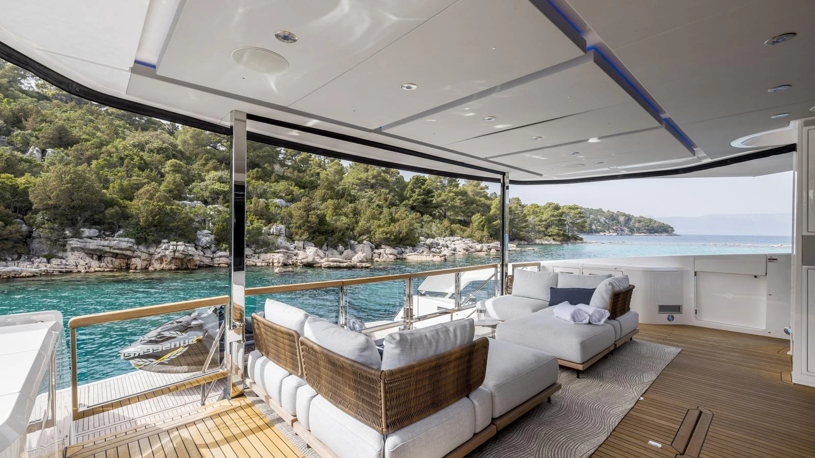 a large pool with a deck aboard EXIT Yacht for Sale