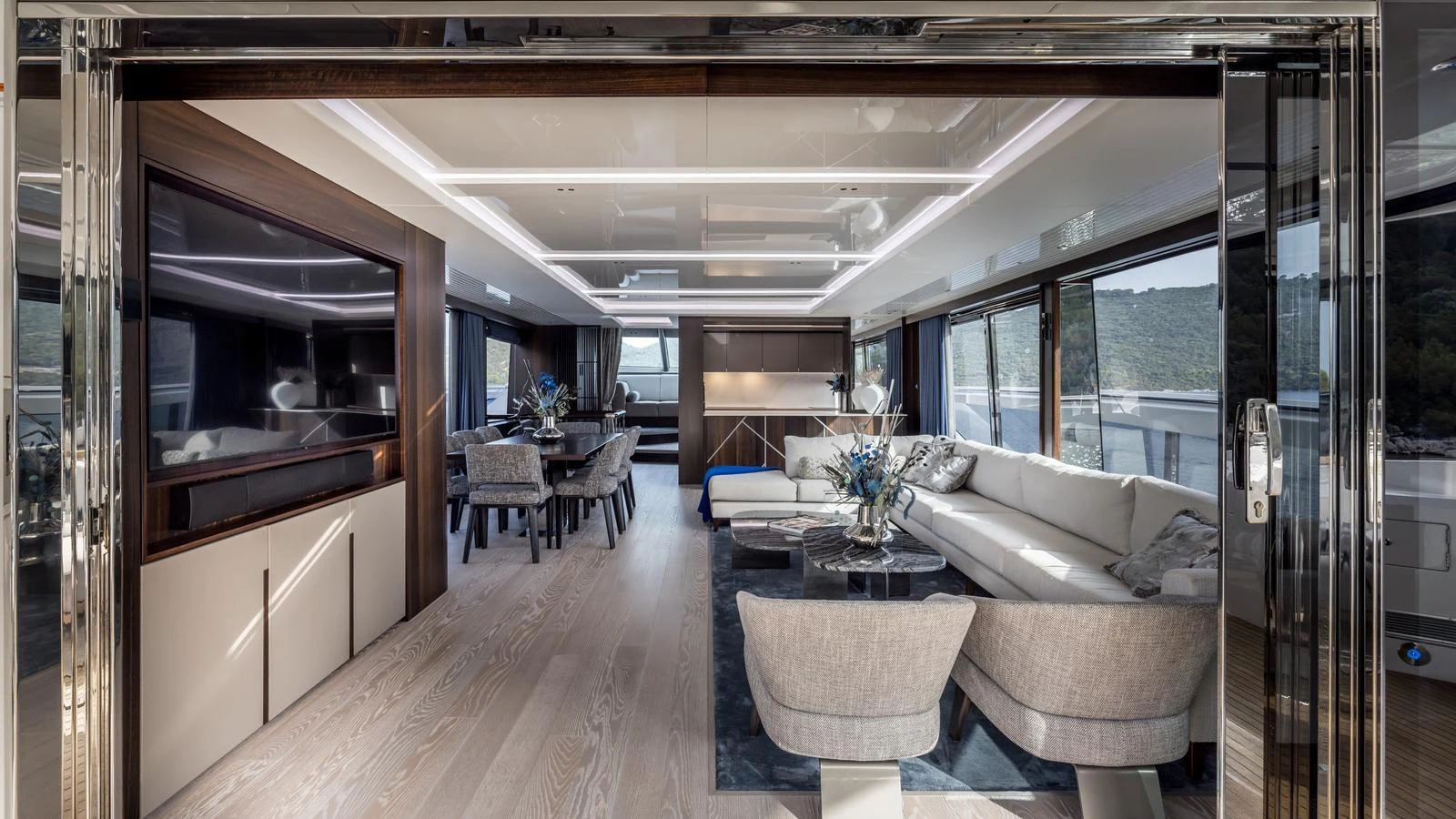 a living room with a large glass door aboard EXIT Yacht for Sale