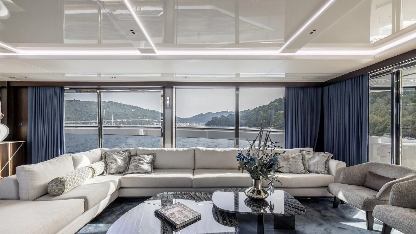 a living room with a large window aboard EXIT Yacht for Sale