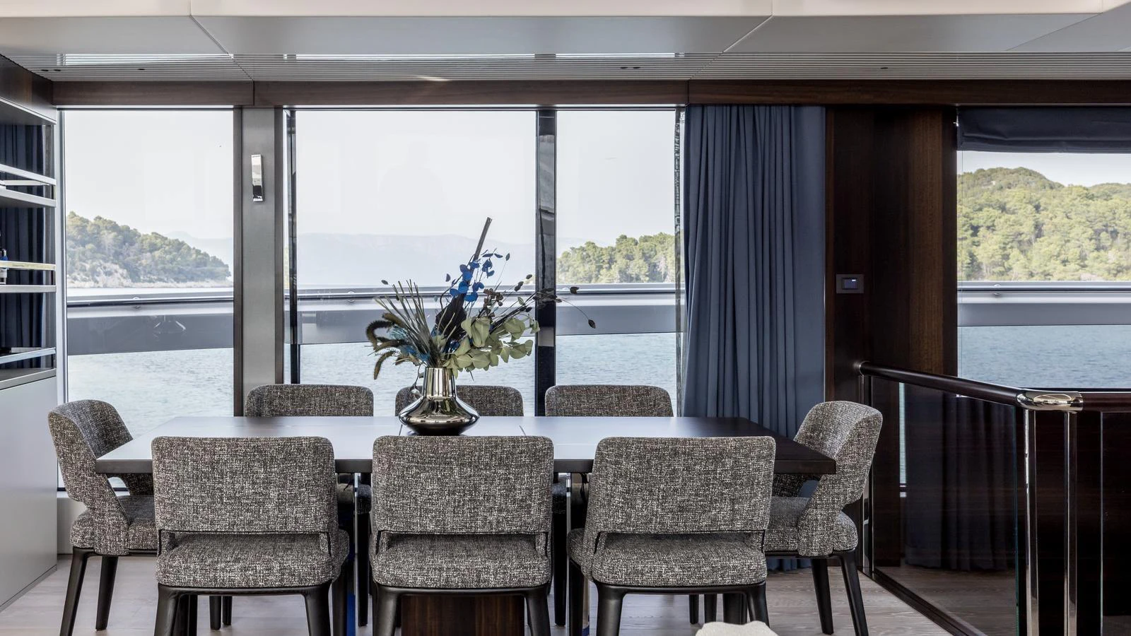 a dining room with a table and chairs aboard EXIT Yacht for Sale