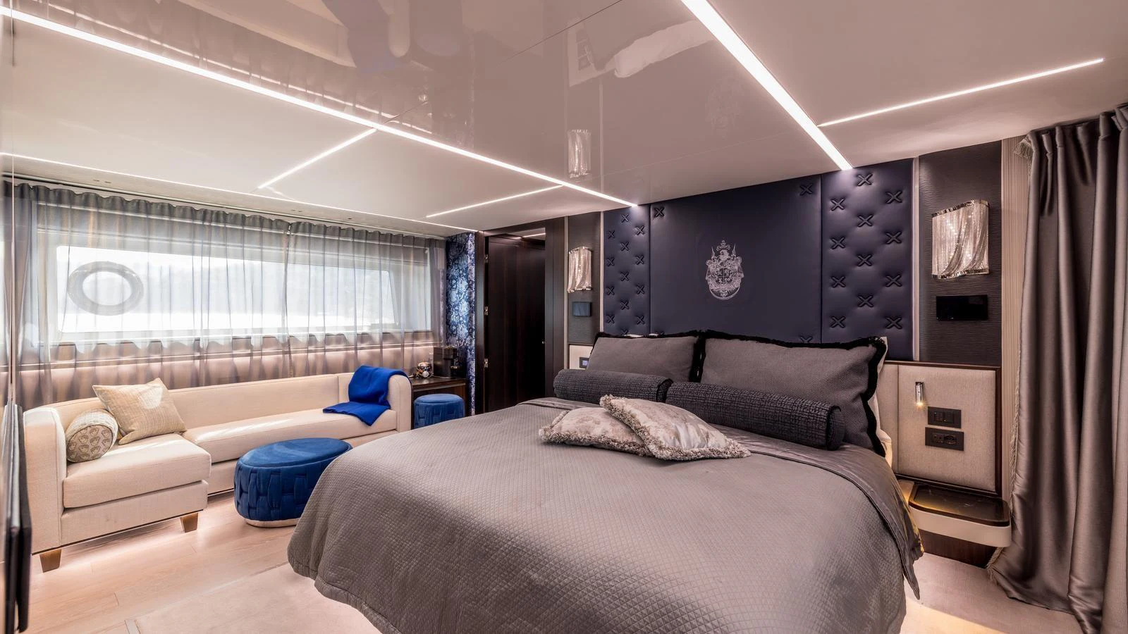a room with a bed and a couch aboard EXIT Yacht for Sale