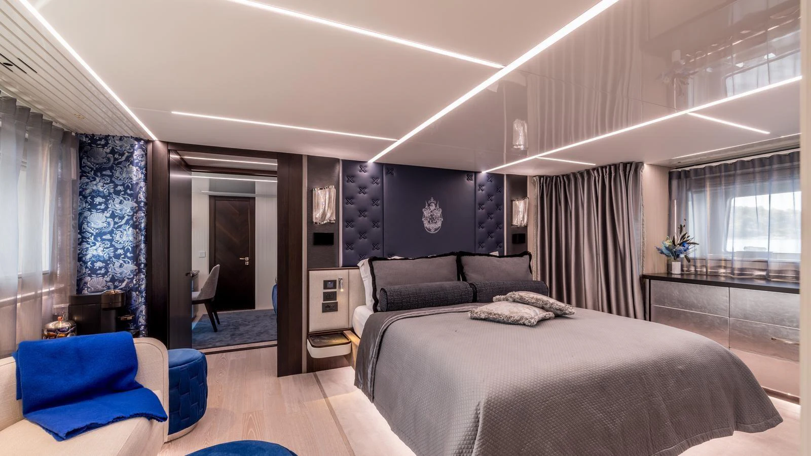 a bedroom with a bed and a couch aboard EXIT Yacht for Sale