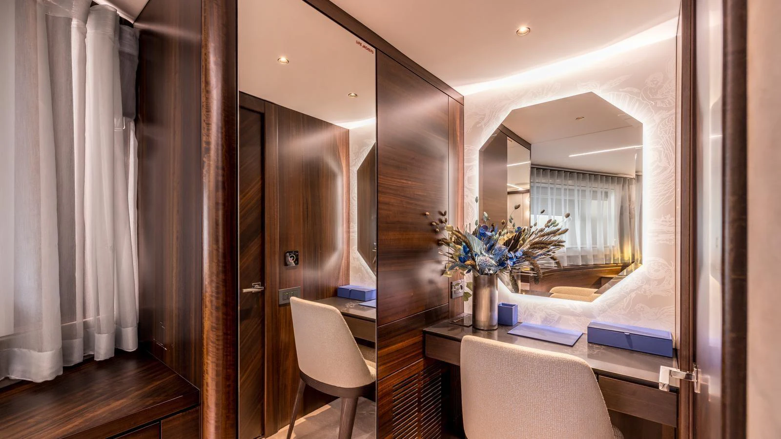 a room with a mirror and a bed aboard EXIT Yacht for Sale